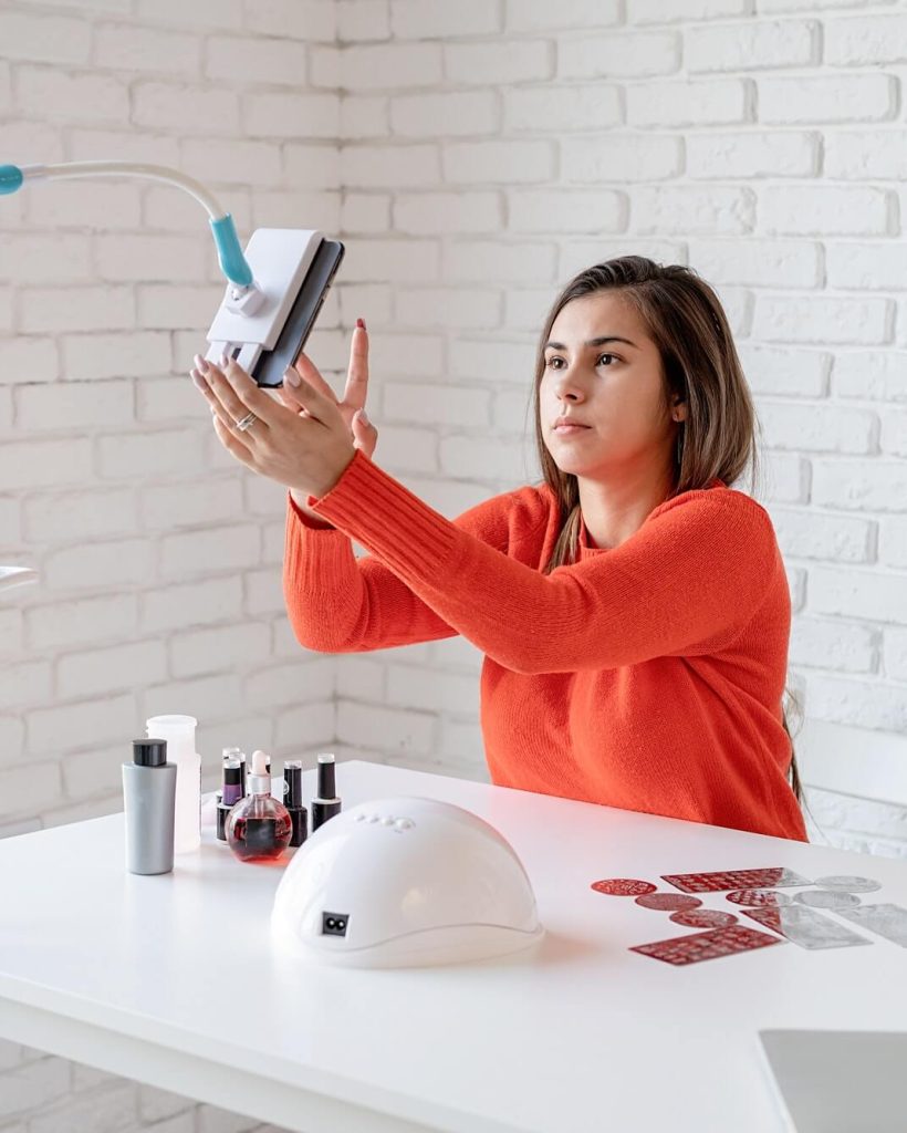beautiful-caucasian-nail-master-influencer-having-video